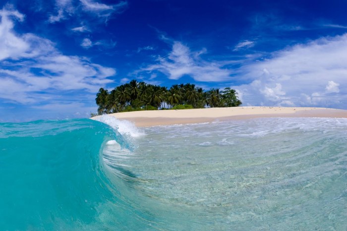 A perfect wave curling onto the beach in the Mentawai Islands, off  Indonesia, 2006